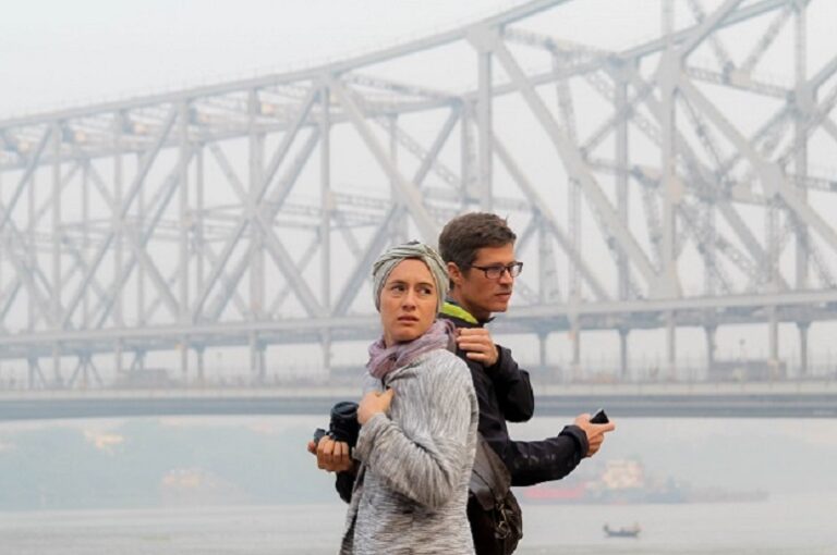 enjoying the iconic howrah bridge on calcutta's best walking tour the magic hour tour.