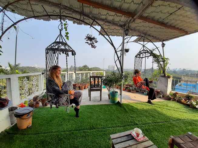 Guests enjoying rooftop of the owls nest Homestay